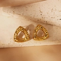 Detailed view of golden triangle stud earrings with irregular lava hammered texture on silk - Irregular Hammered Triangle Style