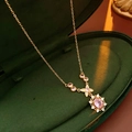 Detail of a vintage gold necklace with pink oval gemstones in a luxury jewelry box - Copper/Zirconia / Necklace / Gold-Pink