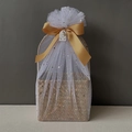 Detail of woven gift basket with white star tulle and large golden satin bow - Antique Gold Full Wrap Star Moon Mesh