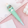 Green cartoon squishy gel pen with cute animal toppers on a pink stationery background - Green Woodpecker