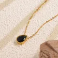 Macro shot of a gold necklace featuring a polished water-drop shaped black stone pendant - Black Teardrop Style (BD024-black)
