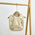 Waterproof baby bib featuring a cute peach pattern and a practical crumb catcher tray - Beige Olive