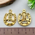Golden horseshoe and cowboy boot charms for DIY jewelry making on a light background - Antique Gold Horseshoe & Boot (19241)