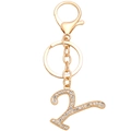 Macro detail of golden letter Y keychain with sparkling white rhinestones and lobster clasp - Letter Y