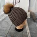 Deep coffee grey ribbed knit beanie for women with a fluffy brown raccoon fur pom pom - Dark Gray