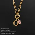 Stainless steel initial O necklace with pink crystal pendant in 14K gold plated finish - Letter O