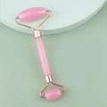 Dual-head pink jade facial roller with rose gold frame on minimalist pastel platforms - Resin Double Head Roller Pink