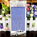 Close-up of 3mm blue round acrylic rhinestones on adhesive sheet for DIY decoration - 6mm / Dark Blue