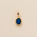Golden birthstone pendant featuring a polished oval blue gemstone and small blue accent - Oval December (Light Blue Zirconia)