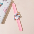 Close-up of pink silicone slap watch with a 3D cartoon unicorn for kids' time learning - Pink