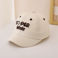 Detail of embroidered 'SÜPER idols' text on beige cotton baseball cap for kids - 48-50cm(1-3 Years) / Beige