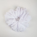 Detailed close-up of a white pleated chiffon hair scrunchie with soft elastic texture - White