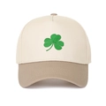 Close-up of green shamrock embroidery on two-tone khaki and beige baseball cap - Beige Crown + Khaki Brim
