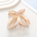 Detailed macro view of the butterfly acetate hair claw clip with golden metal spring - Creamy Mother of Pearl (8)