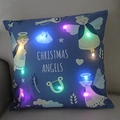 Detail of LED Christmas angel pillow on grey sofa showing glowing lights and embroidery - Dark Blue Christmas Angels-21M-28