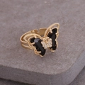 Macro detail of a golden butterfly ring featuring black gemstones and white rhinestones - Adjustable Open / Black