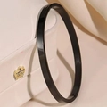 Close-up of polished black stainless steel bangle with a secure clasp mechanism - 6mm / Black