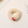 Close-up of fluffy white Christmas scrunchie with a cute small snowman charm detail - Plush Snowman Hair Tie