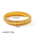 Detail view of 18K gold plated spring snake bracelet with dimensions 6.7cm and 12mm - 12mm Width (NB-B6097-G-12mm) / Gold