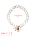 Detail view of pearl beaded bracelet with evil eye charm showing size 174mm and weight - Round Blue Eye Charm