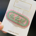 Pink and green embroidered oval BB clip featuring artistic lettering on white card - 11# Green XOXO Style
