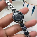 Elegant NAIDU silver stainless steel women watch with black rhinestone dial on wrist - Silver Band Black Dial