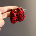 Macro shot of red leopard print C-shape hoop earrings with textured leather wrapping - 6# Silver Earring Post - Red Round