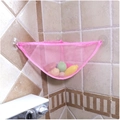 Pink triangular mesh toy organizer with suction cups installed in a bathroom corner - Pink Triangle Bag