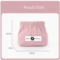 Close-up of pink corduroy lipstick pouch with FREE TRAVEL logo and snap closure - With Label / Pink