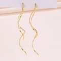 Elegant gold spiral s925 silver long tassel earrings hanging on a white display card - Spiral Tassel / Gold