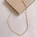 Minimalist gold twist chain bracelet displayed on a jewelry box with elegant metallic finish - Necklace / Gold Caterpillar Style (DX612)