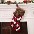 Plaid Christmas stocking with brown faux fur trim and white bone decor hanging on fireplace - Red and Black Plaid Christmas Stocking