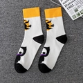 Halloween crew socks with white base, orange cuffs, and playful witch and skull prints - 05 Halloween-White Witch Skeleton