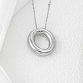 Macro shot of polished silver letter pendant on fine chain with silk accent background - Letter O Pendant