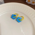 Detailed close-up of colorful flower hoop earrings with yellow ring and blue floral charms - Flower Shape (HE26468) / Yellow-Blue