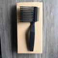 Professional black barber fade comb with dual-density teeth on a cardboard box - Model B Black 1Pc Kraft Box