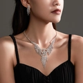 Luxury silver bridal jewelry set featuring sparkling rhinestone star fringe necklace and earrings - Star Tassel Style (DTN14026794S)
