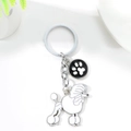 Silver metal poodle keychain with black paw print charm and round hanging ring - White Poodle (White Poodle Paw)