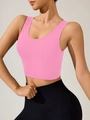 Detail of pink seamless yoga tank top featuring U-neck design and wide shoulder straps - S / Pink