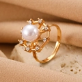 Elegant gold-tone ring with a large white pearl and sparkling rhinestones - Gold Gear Pearl Ring (M-512)