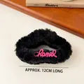 Furry black shark hair claw with pink lettering for elegant autumn and winter styles - Black Plush Letter Hair Claw