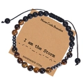 Detail of adjustable Morse code bracelet with black matte beads and tiger eye stones - I am the Storm