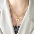 Golden chunky chain necklace featuring heart charms and OT clasp on female model - Gold (P1045)