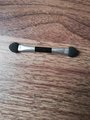 Dual-sided eyeshadow sponge brush with black tips and silver ferrule on wooden background - Metal Tube Double-Ended