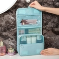 Light blue hanging toiletry bag with multiple waterproof compartments and sturdy hook - Lake Blue