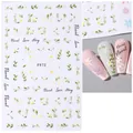 F972 adhesive nail art sticker featuring white floral and green leaf patterns on pink nails - F972 (White Flower Story)