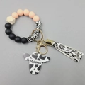 Pink and leopard silicone bead wristlet keychain with Mama wooden cow head and fringe - Light Yellowish Pink