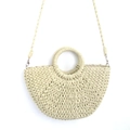 Detail of handmade cream straw half-moon bag featuring woven texture and round handles - Detachable Strap Style / Medium / Off White