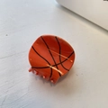 Detailed view of orange basketball hair claw clip with black texture lines and teeth - Small Basketball (5cm)