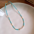 Beaded star and moon necklace with turquoise beads and pearls on a white plate - 22# Luxury Lake Blue Baroque Pearl Necklace
